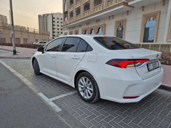 White Toyota Corolla Hybrid Photo 